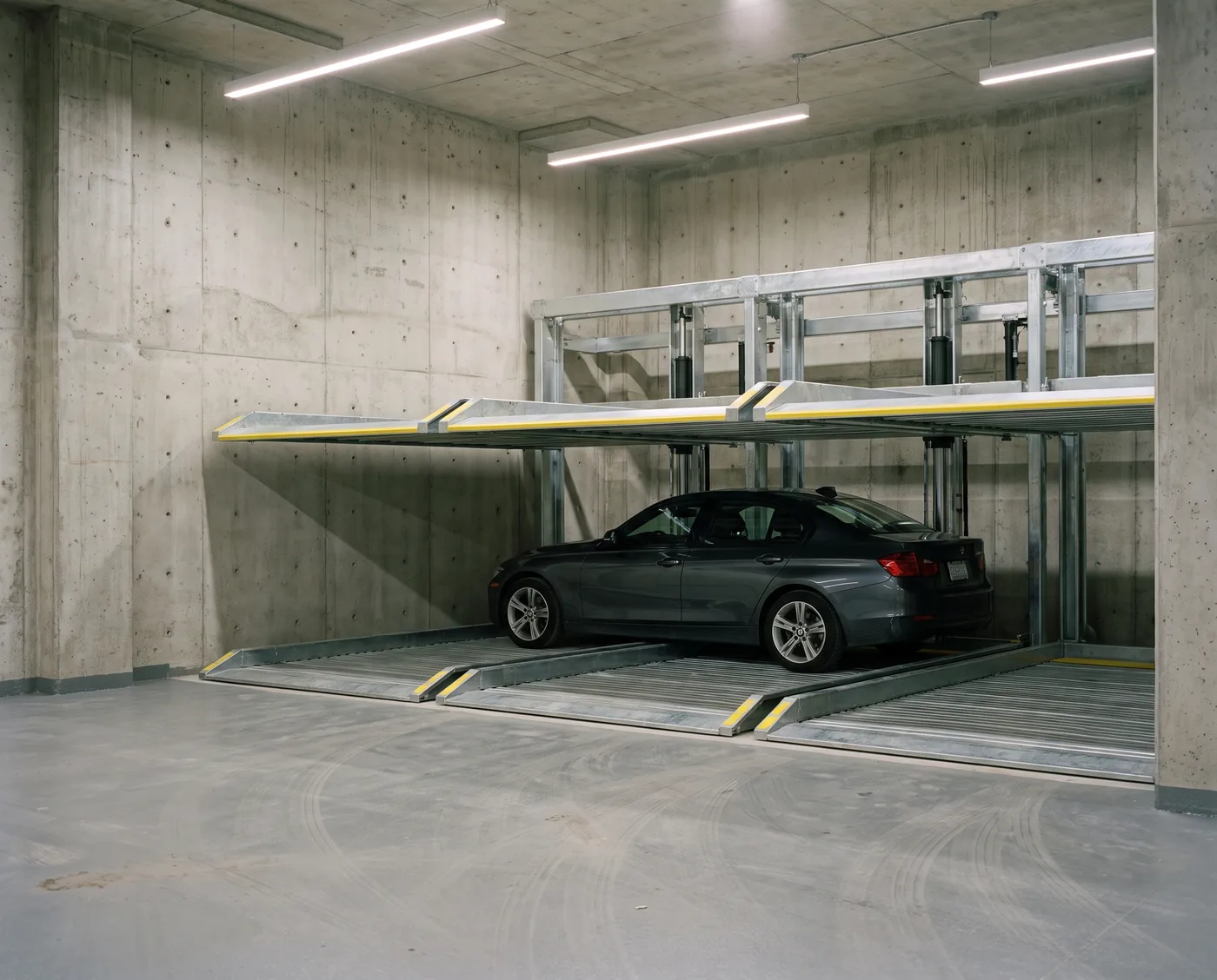 A WVIP double-stacker parking system installed in the concrete parking level of a residential development